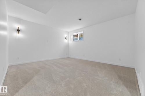Spare room with light colored carpet and baseboards - 132 Heron Point Close, Rural Wetaskiwin County, AB - Indoor Photo Showing Other Room