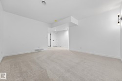 Unfurnished room featuring light carpet and recessed lighting - 