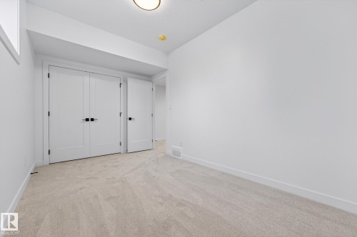 Unfurnished bedroom featuring light carpet and a closet - 132 Heron Point Close, Rural Wetaskiwin County, AB - Indoor Photo Showing Other Room