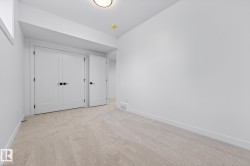 Unfurnished bedroom featuring light carpet and a closet - 