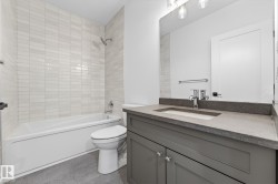 Full bath with vanity and shower / tub combination - 