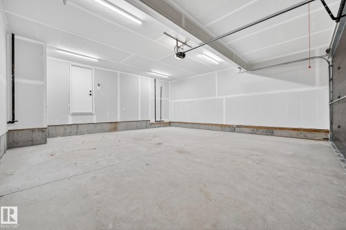 View of garage - 132 Heron Point Close, Rural Wetaskiwin County, AB - Indoor Photo Showing Garage