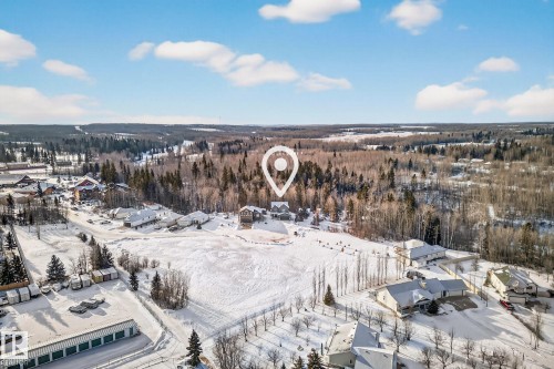 Aerial overview of property's location featuring nearby suburban area - 132 Heron Point Close, Rural Wetaskiwin County, AB - Outdoor With View
