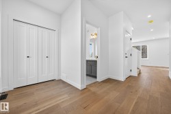 Hallway featuring light wood-type flooring and recessed lighting - 