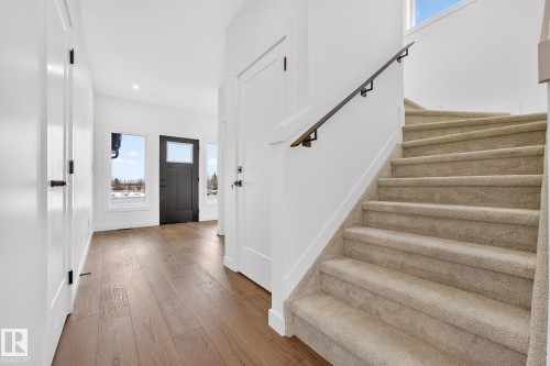 Entrance foyer featuring stairs, light wood-type flooring, and recessed lighting - 132 Heron Point Close, Rural Wetaskiwin County, AB - Indoor Photo Showing Other Room