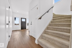 Entrance foyer featuring stairs, light wood-type flooring, and recessed lighting - 