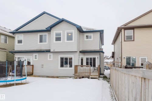 Snow covered property featuring a deck and a trampoline - 3921 167A Avenue, Edmonton, AB - Outdoor