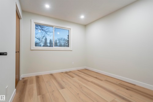Spare room featuring light wood-type flooring and recessed lighting - 47 Manor Drive, Sherwood Park, AB - Indoor Photo Showing Other Room