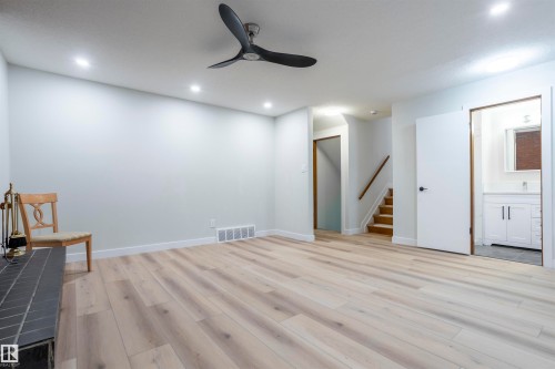 Unfurnished room with light wood-style flooring, a ceiling fan, stairs, and recessed lighting - 47 Manor Drive, Sherwood Park, AB - Indoor Photo Showing Other Room