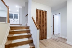 Staircase featuring wood finished floors and baseboards - 