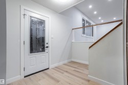 Entrance foyer with baseboards and light wood-type flooring - 