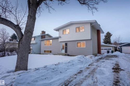 Split level home featuring a chimney and a garage - 47 Manor Drive, Sherwood Park, AB - Outdoor