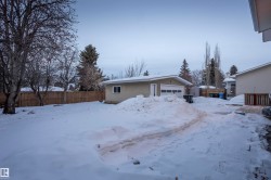 View of front of home with an outbuilding and stucco siding - 