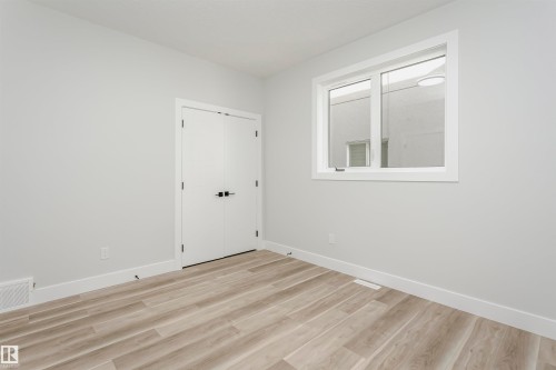 Bedroom featuring light wood-style flooring - 1723 19 Street, Edmonton, AB - Indoor Photo Showing Other Room