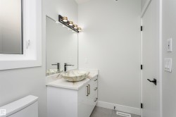 Bathroom featuring vanity and light tile patterned flooring - 