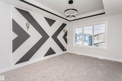 Unfurnished room with carpet and a raised ceiling - 1723 19 Street, Edmonton, AB - Indoor Photo Showing Other Room