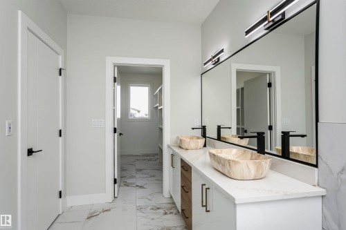 Bathroom with vanity and light marble finish flooring - 1723 19 Street, Edmonton, AB - Indoor Photo Showing Other Room