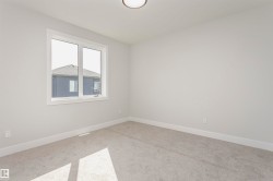 Unfurnished room featuring carpet floors and baseboards - 