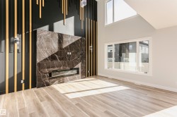 Interior space with LVP finished floors and a premium fireplace - 