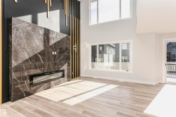 Detailed view of LVP finished floors and a premium fireplace - 