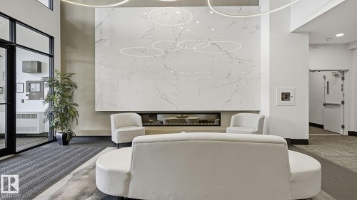 311 7463 May Common, Edmonton, AB - Indoor Photo Showing Other Room With Fireplace