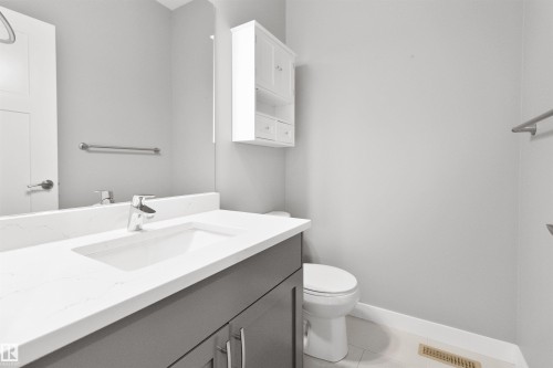 Bathroom with vanity and light tile patterned floors - 107 Cresthaven Grove, Ardrossan, AB - Indoor Photo Showing Bathroom