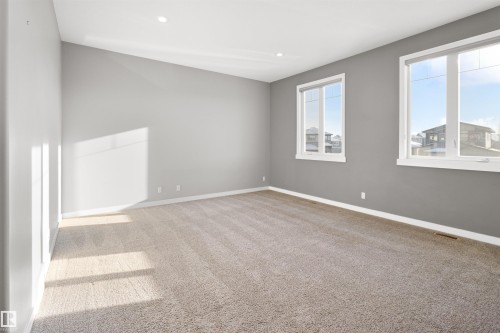 Empty room featuring light carpet and recessed lighting - 107 Cresthaven Grove, Ardrossan, AB - Indoor Photo Showing Other Room