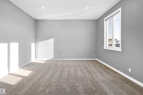 Empty room with light colored carpet and recessed lighting - 107 Cresthaven Grove, Ardrossan, AB - Indoor Photo Showing Other Room