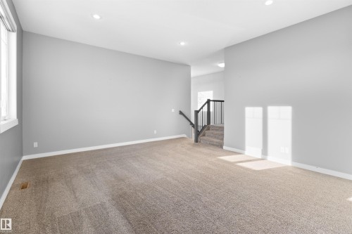 Spare room with recessed lighting, carpet, and stairs - 107 Cresthaven Grove, Ardrossan, AB - Indoor Photo Showing Other Room