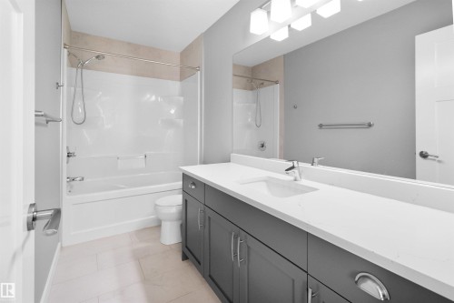 Full bath with vanity, shower / bath combination, and light tile patterned flooring - 107 Cresthaven Grove, Ardrossan, AB - Indoor Photo Showing Bathroom