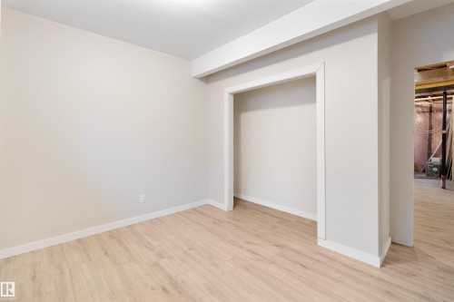 Unfurnished bedroom featuring light wood-style floors and a closet - 107 Cresthaven Grove, Ardrossan, AB - Indoor Photo Showing Other Room