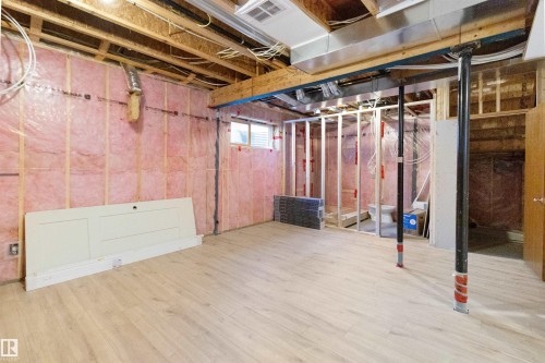 Below grade area with wood finished floors - 107 Cresthaven Grove, Ardrossan, AB - Indoor Photo Showing Basement