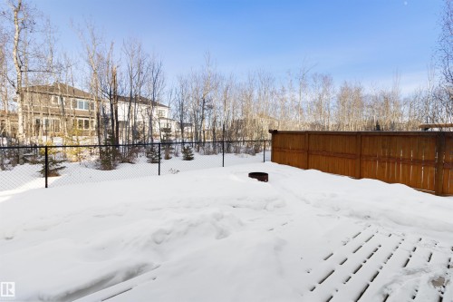 Yard layered in snow with a residential view - 107 Cresthaven Grove, Ardrossan, AB - Outdoor