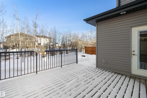 Snow covered deck with a residential view - 107 Cresthaven Grove, Ardrossan, AB - Outdoor With Exterior
