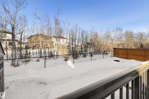 Yard layered in snow with a residential view - 107 Cresthaven Grove, Ardrossan, AB - Outdoor