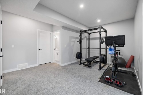7027 54 Avenue, Beaumont, AB - Indoor Photo Showing Gym Room