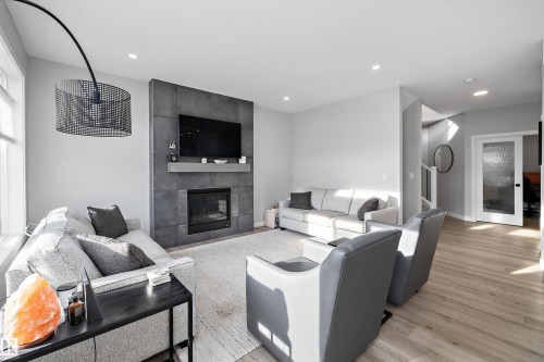 7027 54 Avenue, Beaumont, AB - Indoor Photo Showing Living Room With Fireplace