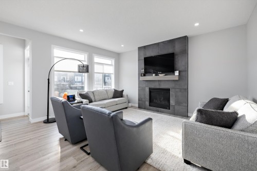 7027 54 Avenue, Beaumont, AB - Indoor Photo Showing Living Room With Fireplace
