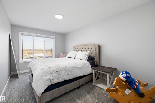 7027 54 Avenue, Beaumont, AB - Indoor Photo Showing Bedroom