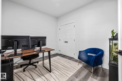 Office space with wood finished floors and baseboards - 