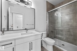 Full bath featuring vanity and a stall shower - 