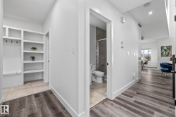 Hallway featuring light wood finished floors and recessed lighting - 
