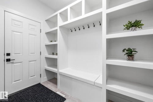 Mudroom featuring light tile patterned floors - 5304 Kimball Place, Edmonton, AB - Indoor With Storage