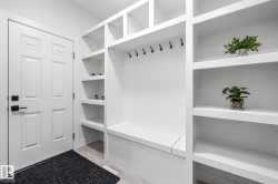 Mudroom featuring light tile patterned floors - 