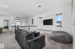 Living area with light carpet - 