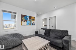 Carpeted living area with baseboards and recessed lighting - 