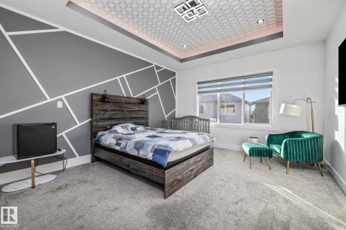Bedroom featuring a raised ceiling and carpet - 5304 Kimball Place, Edmonton, AB - Indoor Photo Showing Bedroom
