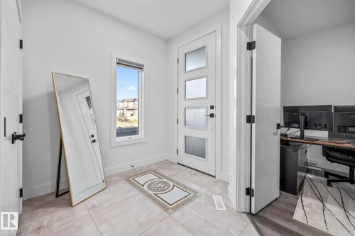 Foyer entrance with light tile patterned floors - 5304 Kimball Place, Edmonton, AB - Indoor Photo Showing Other Room