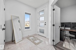 Foyer entrance with light tile patterned floors - 