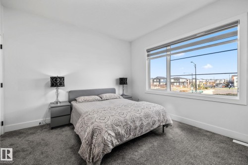 Bedroom with carpet and baseboards - 5304 Kimball Place, Edmonton, AB - Indoor Photo Showing Bedroom